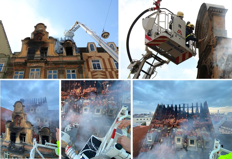 THW - standing in a small personnel carrier next to a building in flames. Augsburg fire
